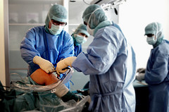 doctor performing surgery on knee