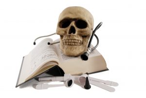 Medical book and a skull model for studying medicine